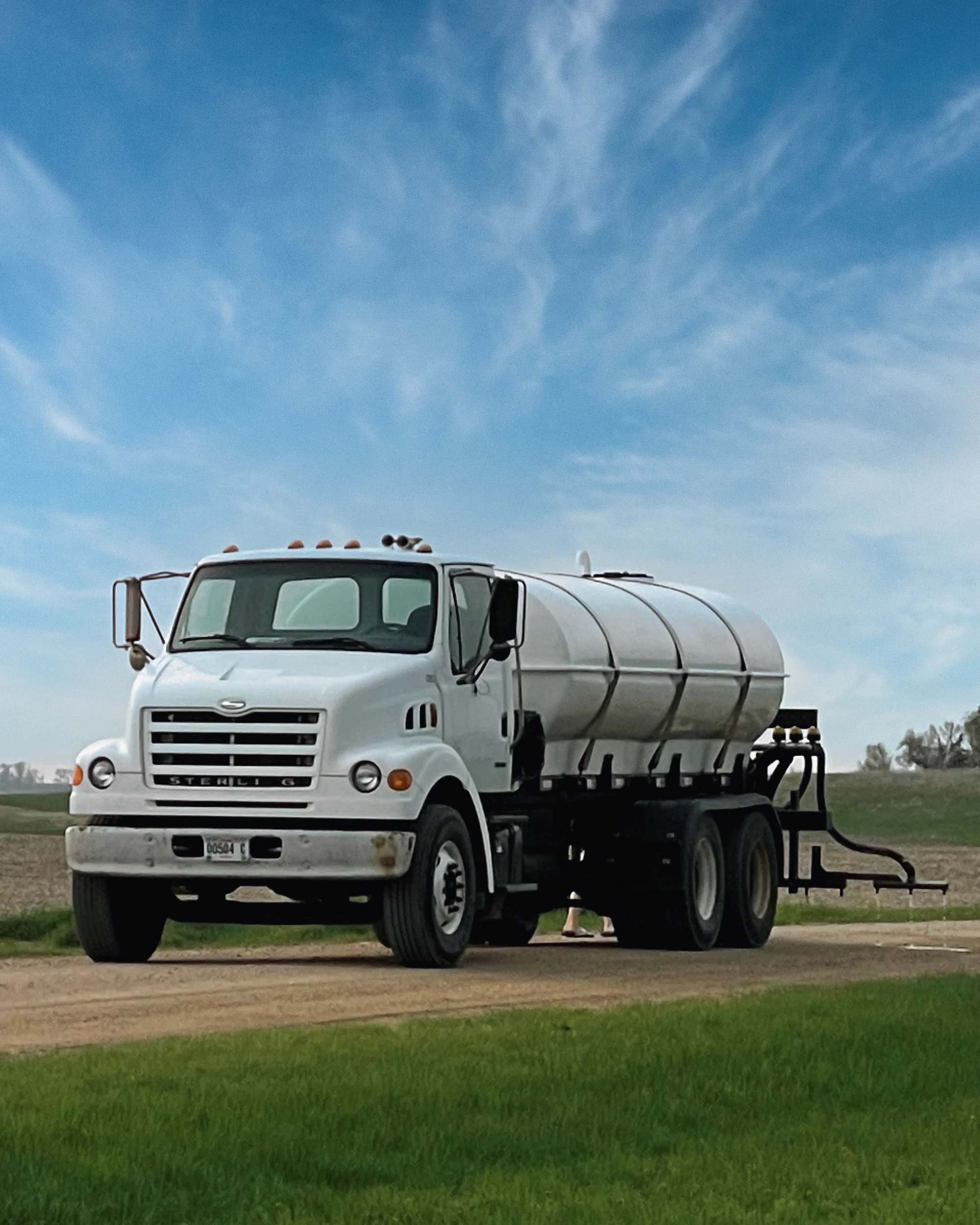 Applying dust control applicatio on gravel road